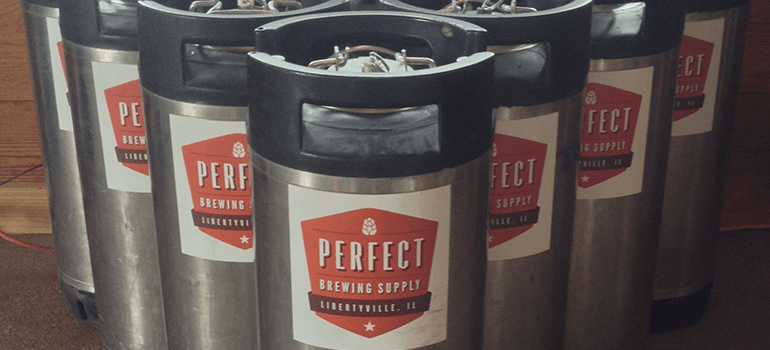 Several beer gas cylinders with Perfect Brewing Supply logo on them